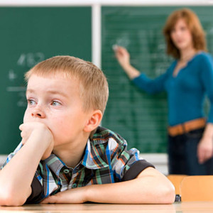 Distracted Student in Classroom --- Image by © Wolfgang Flamisch/Corbis